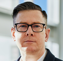 Alexander Hughes, CEO und Führungskraft an der Spitze eines Krypto-Trading-Unternehmens, im Porträt